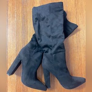 Knee high heeled black boots, never worn.